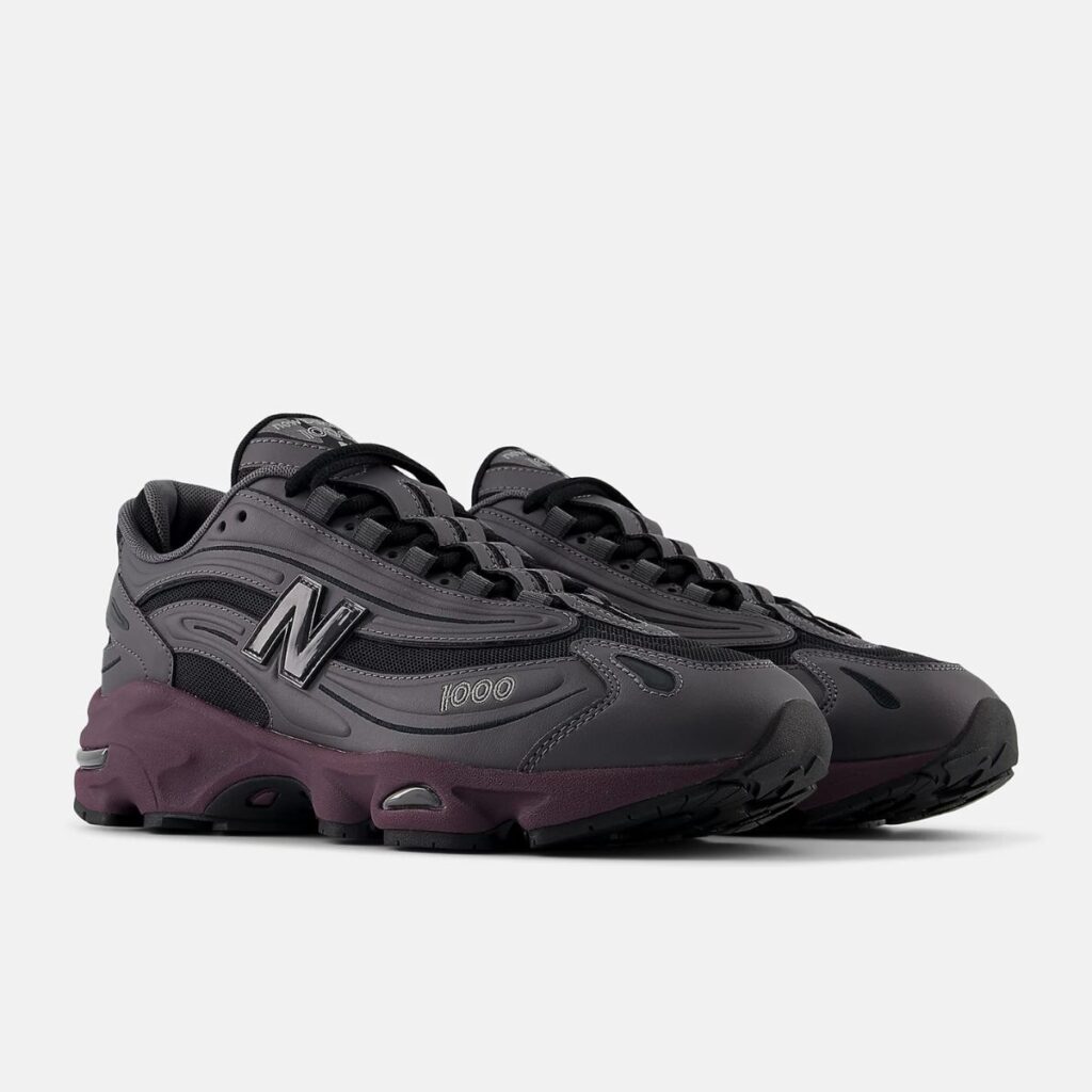 O New Balance 1000 "Magnet Plum Brown" é a fusão perfeita entre tradição e modernidade. Um ícone do conforto e performance, este tênis reimagina o clássico modelo 1000 com uma paleta de cores que evoca a natureza e o estilo urbano.