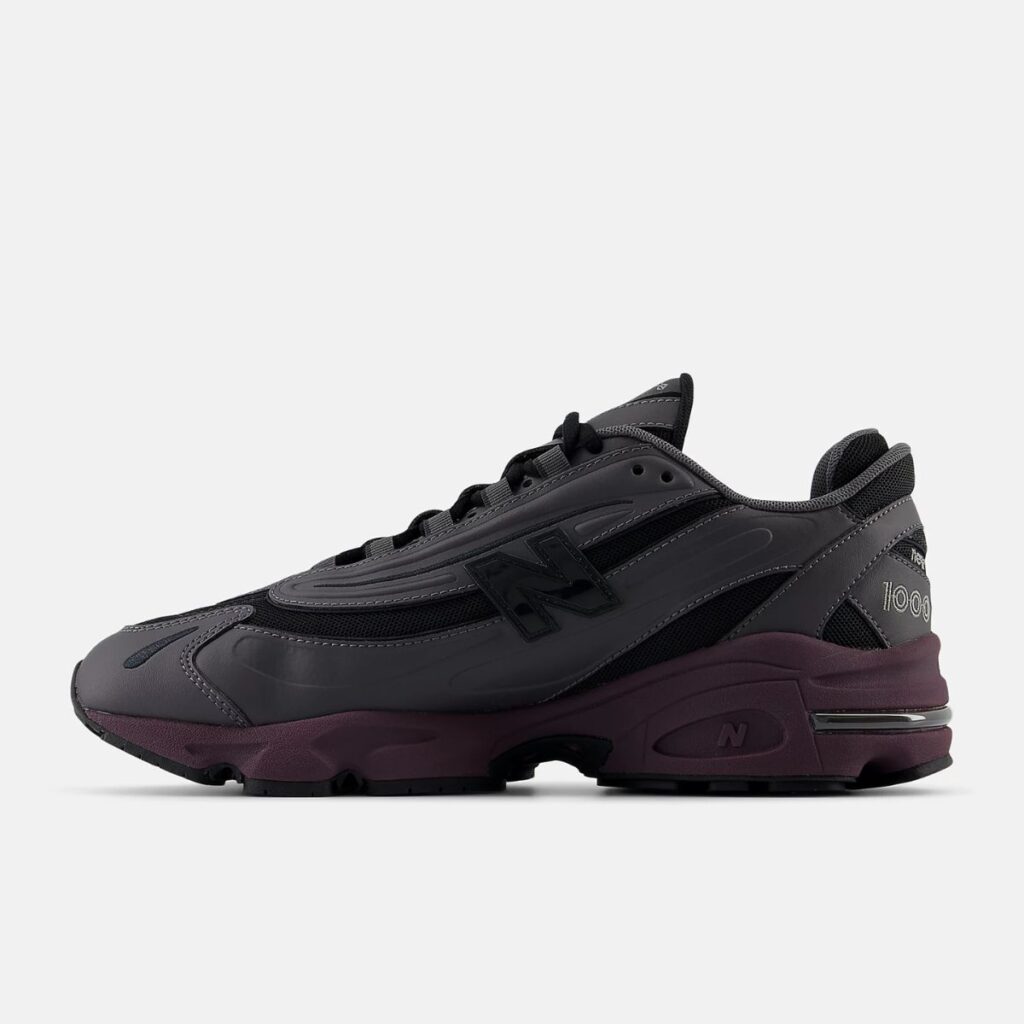 O New Balance 1000 "Magnet Plum Brown" é a fusão perfeita entre tradição e modernidade. Um ícone do conforto e performance, este tênis reimagina o clássico modelo 1000 com uma paleta de cores que evoca a natureza e o estilo urbano.